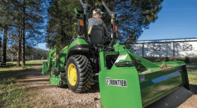 Frontier box blade in a driveway